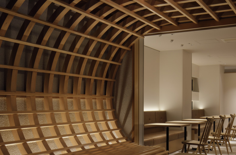 the wooden arch functions as outside seating - Daisuke Shima