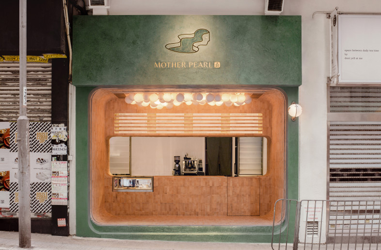From the cloud of pearl-shaped lights floating above, to the dark olive green facade that opens a portal to a mystical universe, Mother Pearl expresses dimension through its organic materiality, drawing the consumer deeper into the sweetness of the present. - Photographer: Amanda Kho