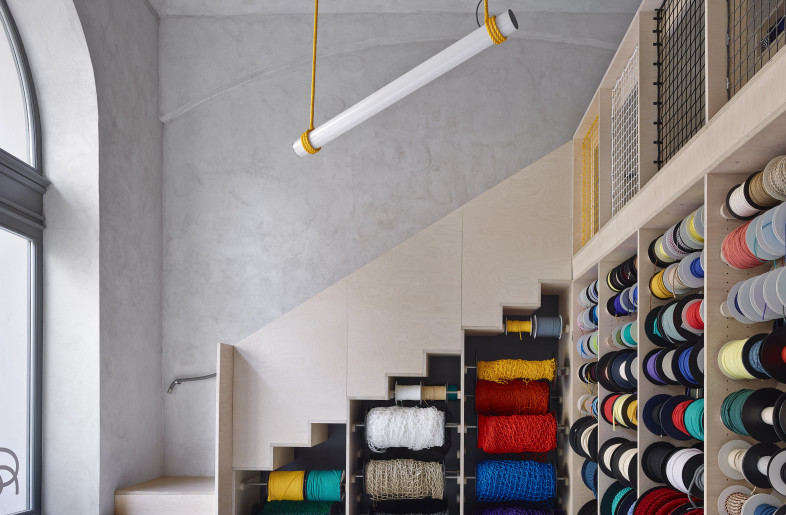 Rope shop racks with the staircase - JRA Jarousek Rochova Architekti