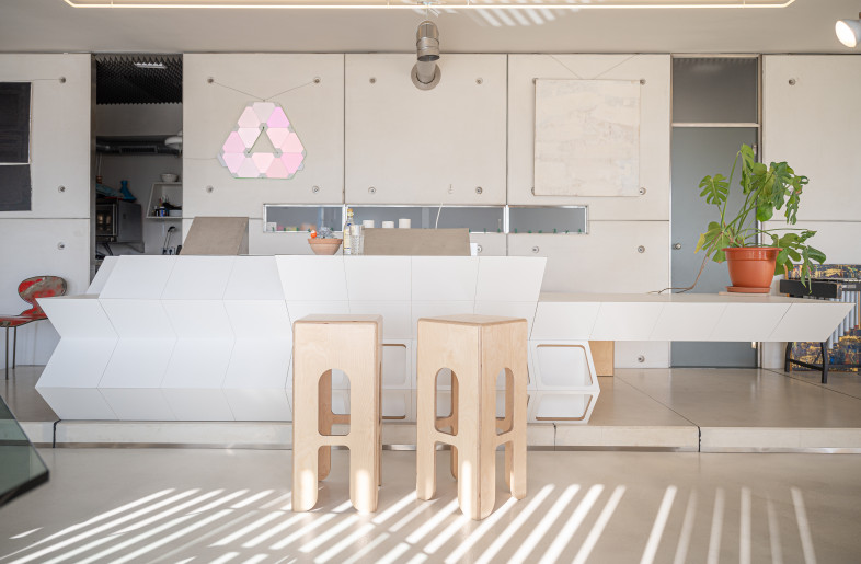 GRC walls consisting of Modular Glass Reinforced White Concrete Panels designed specifically by KEIGIO and Original Central Unit Furniture - Photographer: Adina Ilie