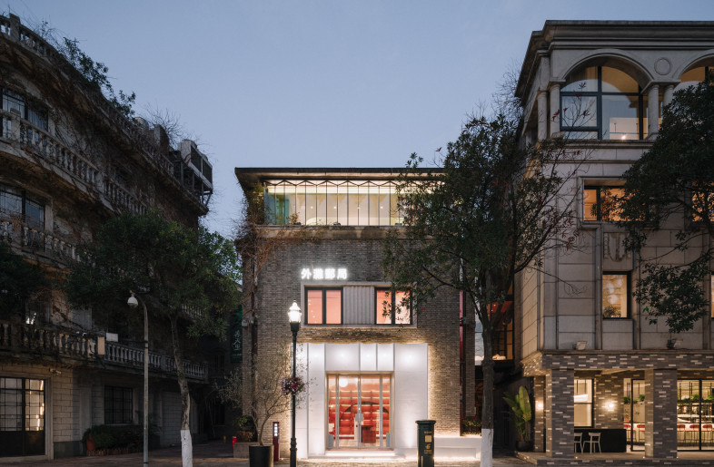 Post Office Façade at dusk - Photo Credit: Wen Studio