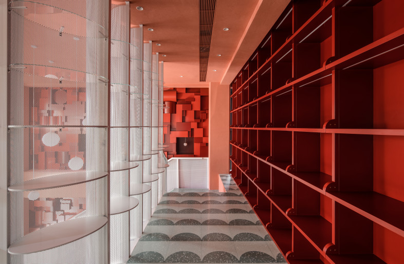 Bund Post Office 2nd Floor: Product displays are integrated into both the built in shelves and the see-through mesh structure, creating a more open and transparent retail space. - Photo Credit: Wen Studio