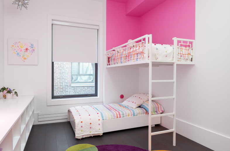 The kids room features custom designed stacked beds,  cabinets and bookcases. - Federica Carlet