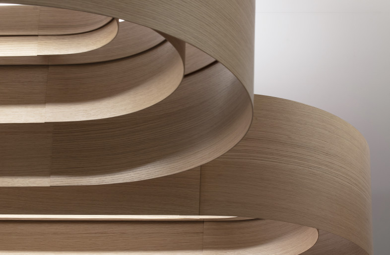 The architectural design was inspired by the clients’ logo and the graphic nature of traditional Japanese rock gardens. The traditional Japanese rock gardens are metaphorical ground forms comprised of carefully arranged patterns that symbolize water ripples, which in turn express the beauty and balance found in nature. - Paul Warchol