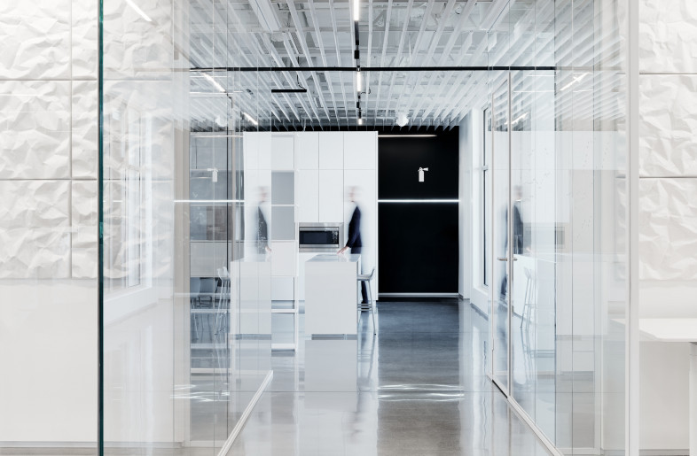 The grid traverses the elements and functions within the overall space in a visual connection emphasized through a linear graphic system across the floor and echoed in the lighting system in the ceiling. - Joe Fletcher