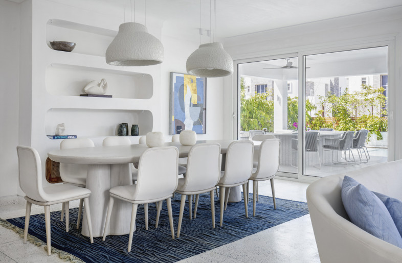 The dining area’s textured lighting fixtures are made using recycled materials. - Louay Nasser