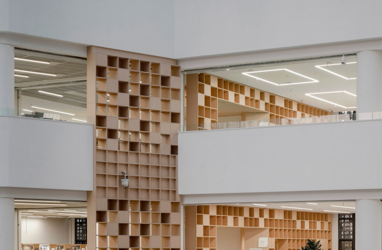 the architecture facade is covered with the perforated curtain wall - Photographer: SHI Yunfeng