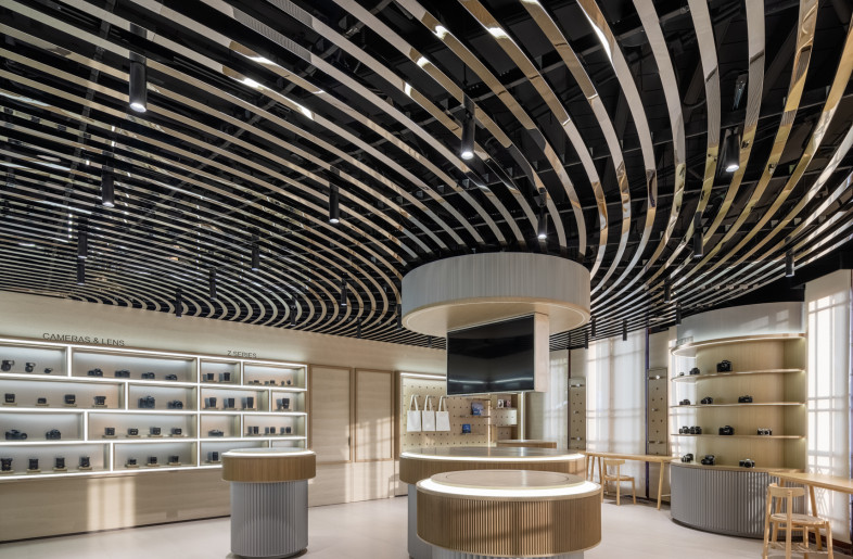 a display area balancing futuristic features with warm tone and textures - Wen Studio