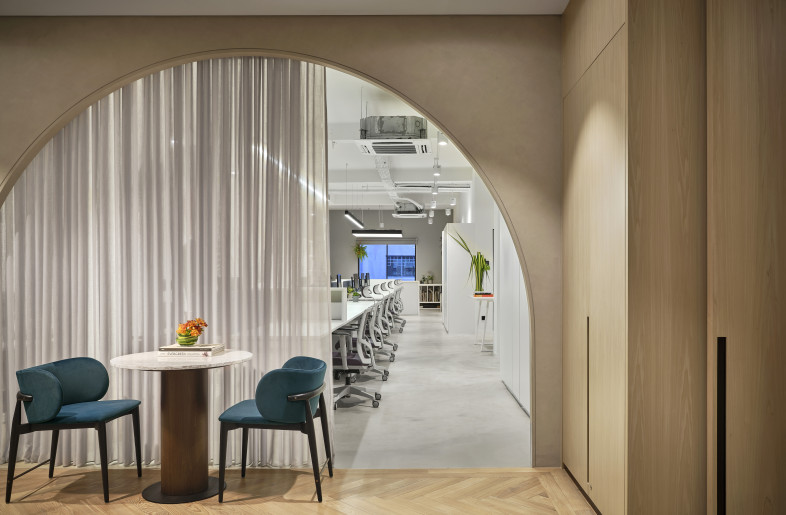 Breaking up the straight lines of the space are arches that mimic the curves from the Elgin Bridge. The sheer curtain provides the Director with some privacy from the main office area. - Owen Raggett