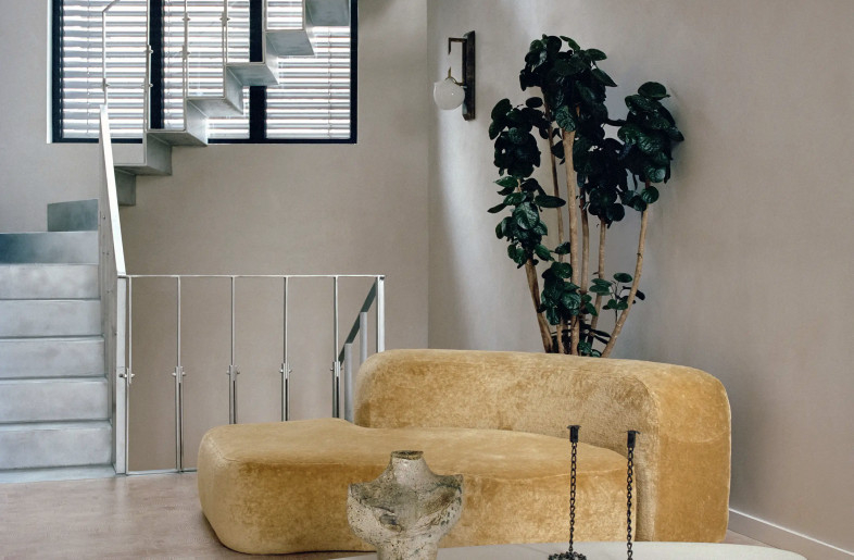 retro yellow velvet designer sofa by Ennio Chiggio in a stylish, off-white living room - Christophe Coënon
