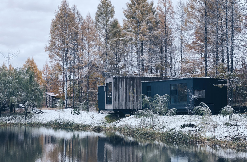 view of the building from the lake - Poly Design Stodio