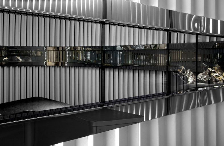 One-way mirrors revealing the jewelry as customer walks closer (off) - Alan Chan Design Company