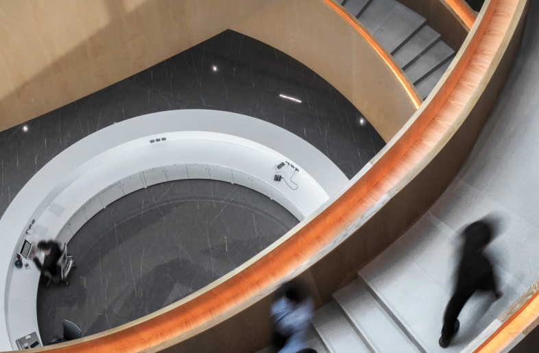 Stairs start to spiral up from the reception area - Sam