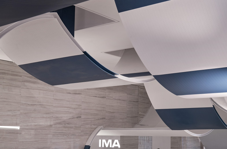 Extend the arc from the ceiling and stretch to the ground. This arc design transforms on the ground to counters - Jonathan Leijonhufvud Architectural Photography