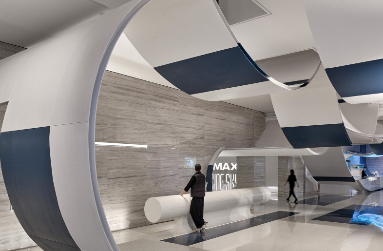The arc shapes on both sides of the hallway follow the curve of the walls and extend out from the ceiling. It seems that the audience can walk inside of the ‘floating clouds’. - Jonathan Leijonhufvud Architectural Photography