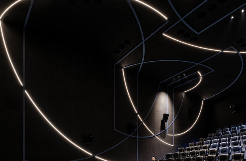 Simple arc-shaped lines to connect the wall and ceiling. Decorative blue lines are matched with the arc light strips to enhance the dynamic feeling of the space. - Jonathan Leijonhufvud Architectural Photography