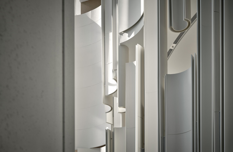 The arc-shaped elements throughout the interior are an abstract way of resembling the petals of the peony in full bloom - Jonathan Leijonhufvud Architectural Photography
