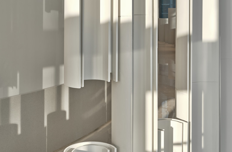 Light changes as the sunrise and fall each day - the light shines on the curved metal plates and the shadows reflected on the ground will also change over time. - Jonathan Leijonhufvud Architectural Photography