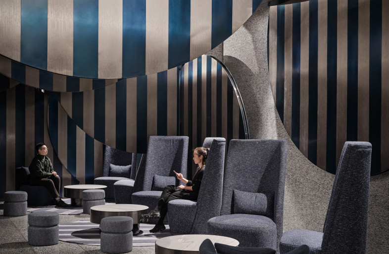We use round metal sheets that are interspersed in a vertical and horizontal manner to form the overall space. They layered and stacked on top of each other to enhance the interior space. Blue and white colors are used throughout the areas as a unified concept. - Jonathan Leijonhufvud Architectural Photography