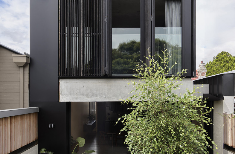 Operable screens from rear courtyard. - Anson Smart
