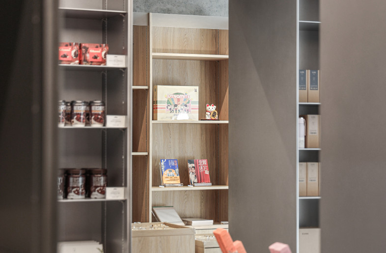 Wooden retail area is framed by the aluminum cabinet - Timmy Lo