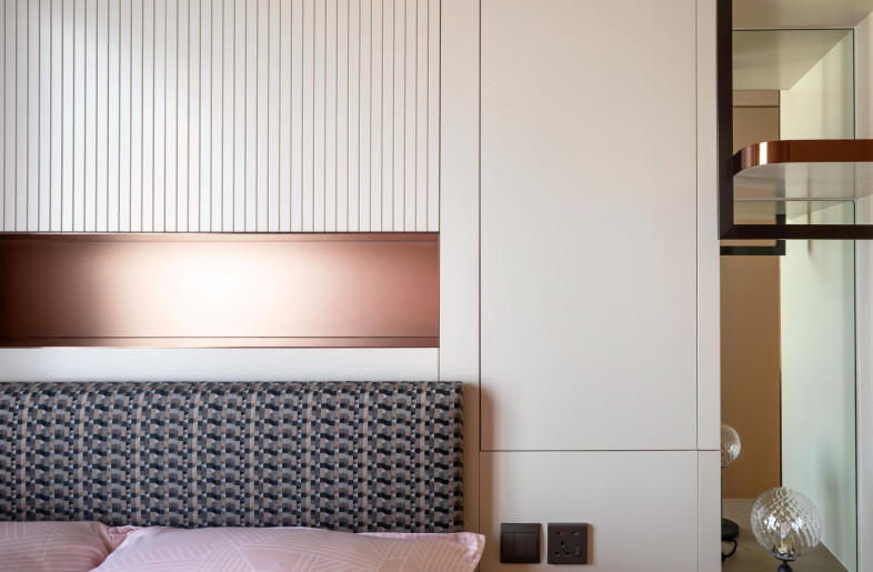 Daughter's bedroom features a playful blush pink colour palette with inbuilt wood cabinets and shelves - Mr. Edmon Leong