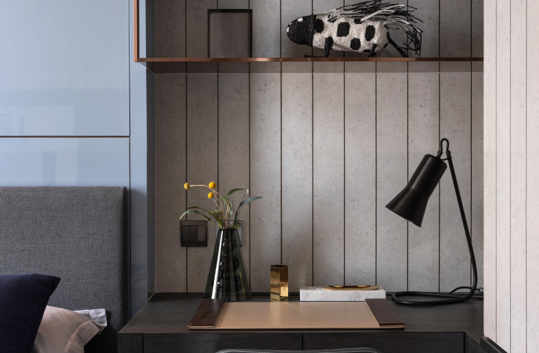 Son's bedroom features a dark blue and concrete grey colour palette with copper accents. - Mr. Edmon Leong