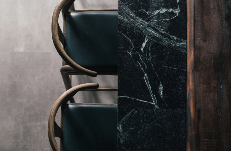 Sitting on top of the Verdi Alpi green marble is a wood slab that OWIU charred using the Japanese Shou Sugi Ban technique. - Finbarr Fallon