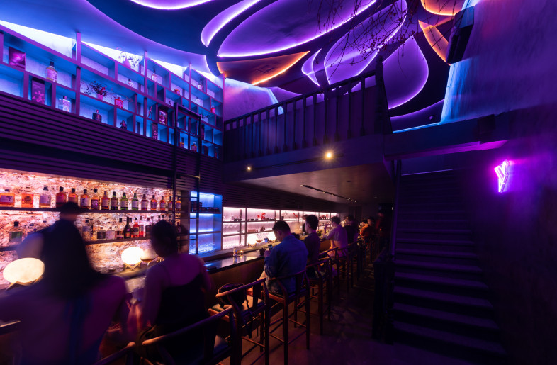 A 4x8-meter neon installation floats above diners and reflects the restaurant’s logo. - Finbarr Fallon