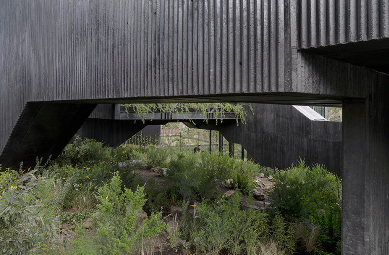 Exterior View, facade and entrance with interior patio at the background. - Jaime Navarro