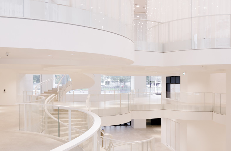 The entrance hall forms the visual heart of the building. Its open and flexible design offers a departure from the strict, orthogonal grid of the other floors. Spiral staircases connect the architectural islands across the floors and give the impression that the area is a loosely connected network. - Daisuke Hirabayashi