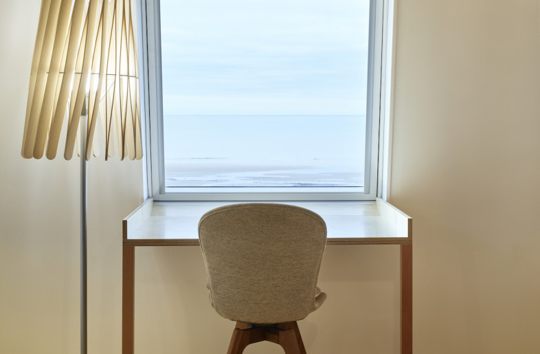 The small apartment overlooks the Normandy coast. - Philippe Piron