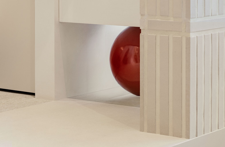 the red crystal in the form of a circle that tells the end of the care space and the beginning of the rest space - Yongjoon Choi