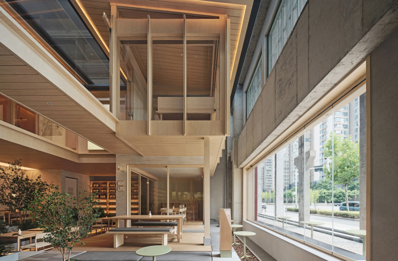 Double storey restaurant space framed by historic building - ingallery